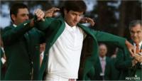 Bubba Watson of the US (C) receives his green jacket from 2011 champion Charl Schwartzel of South Africa (Reuters) Bubba Watson of the US (C) receives his green jacket from 2011 champion Charl Schwartzel of South Africa (Reuters)