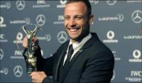 South African Oscar Pistorius poses for photographs with his award at the 2012 Laureus World Sports Awards in London. South African Oscar Pistorius poses for photographs with his award at the 2012 Laureus World Sports Awards in London.
