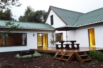 Gypsy Forest - R1200/night for house (sleeps 7): A large deck for entertainment and lounging during the day or viewing stars at night. Braai for outside cooking.